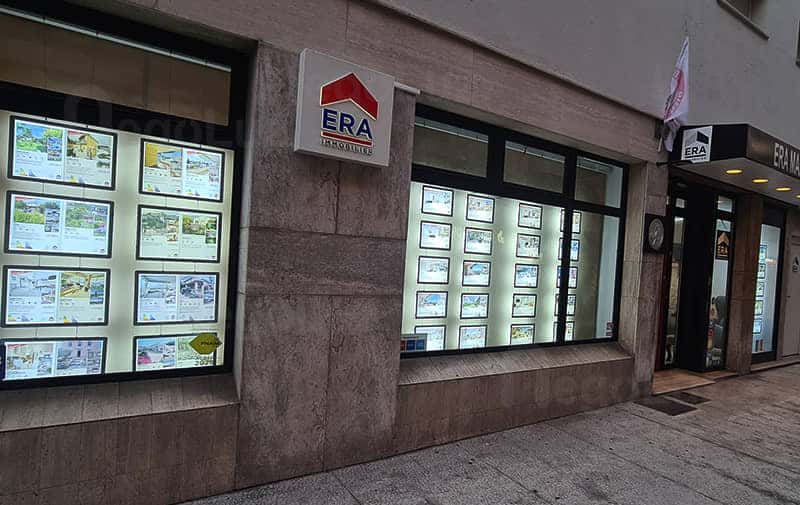 estate broker window display